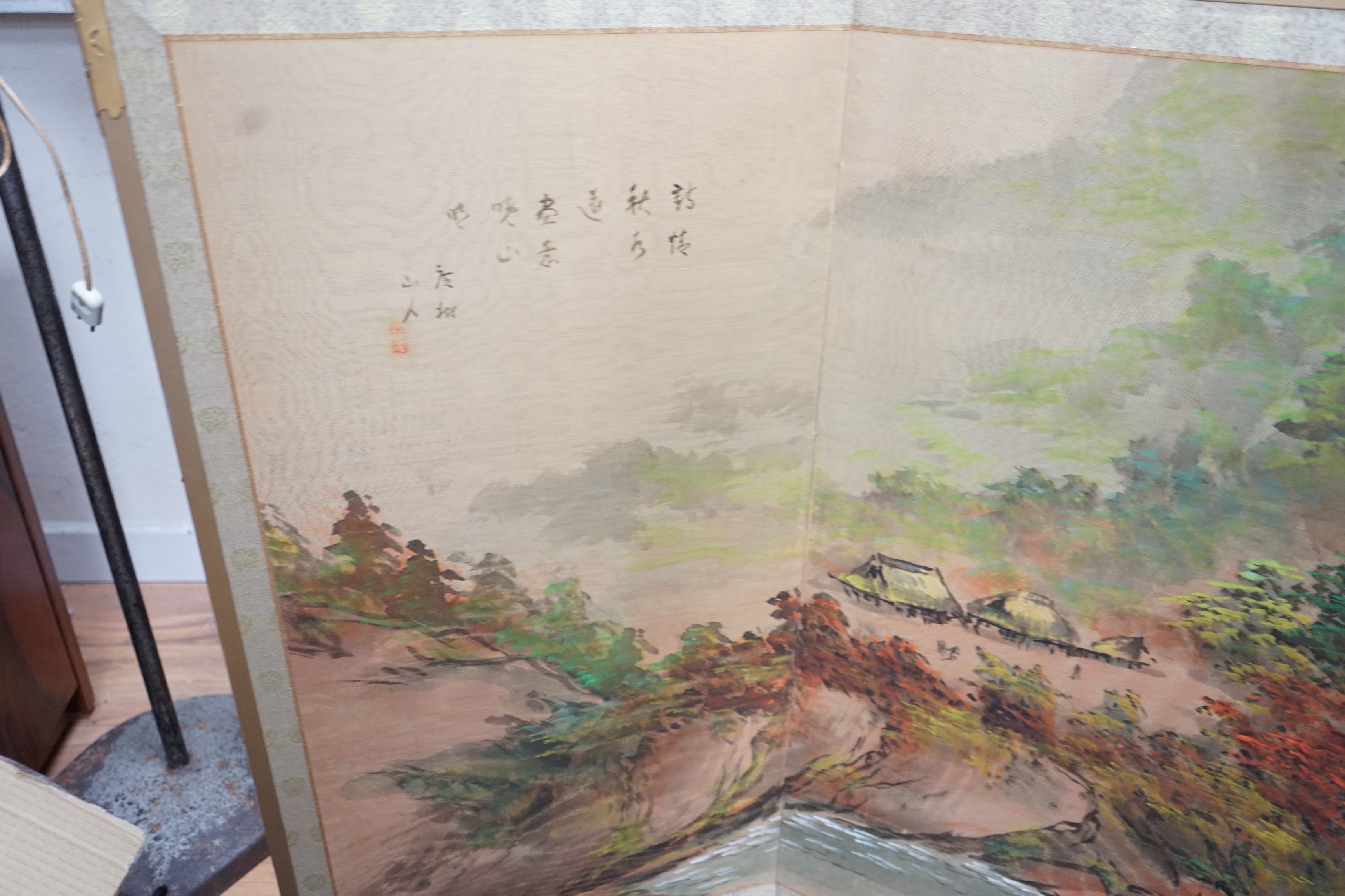A Chinese painted four fold low screen, each panel width 46cm, height 91cm